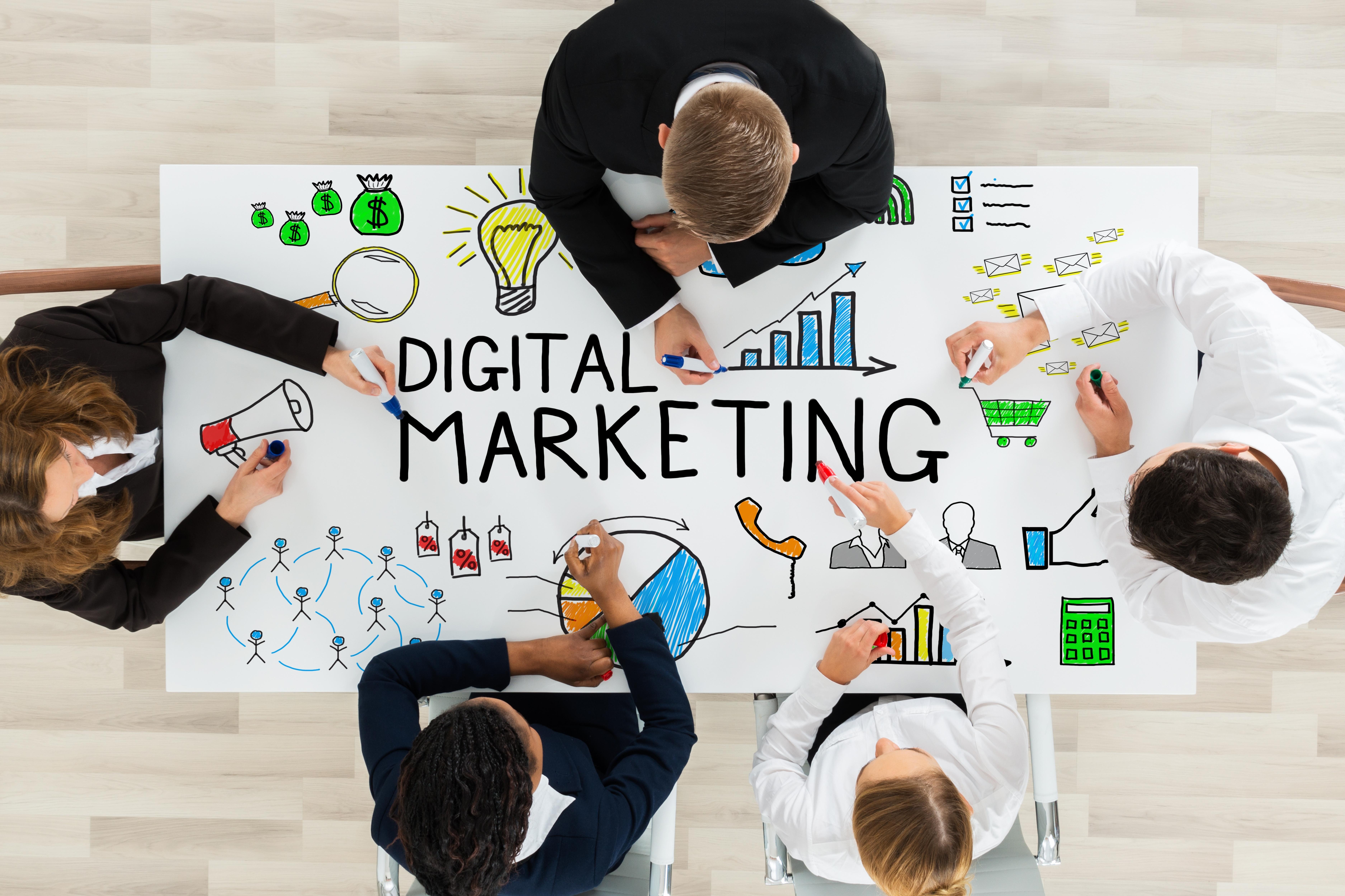 80375businesspeople-drawing-digital-marketing-diagram-table.jpg